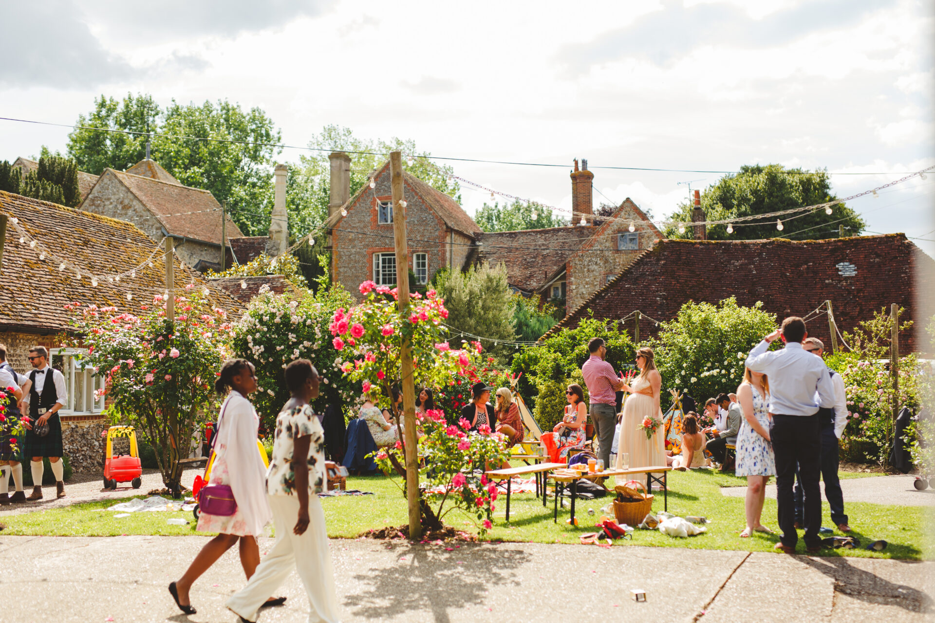 Friends and family guests at barn wedding with accommodation at Sullington Manor Farm, West Sussex, RH20 4AE. Farm wedding in South Downs.