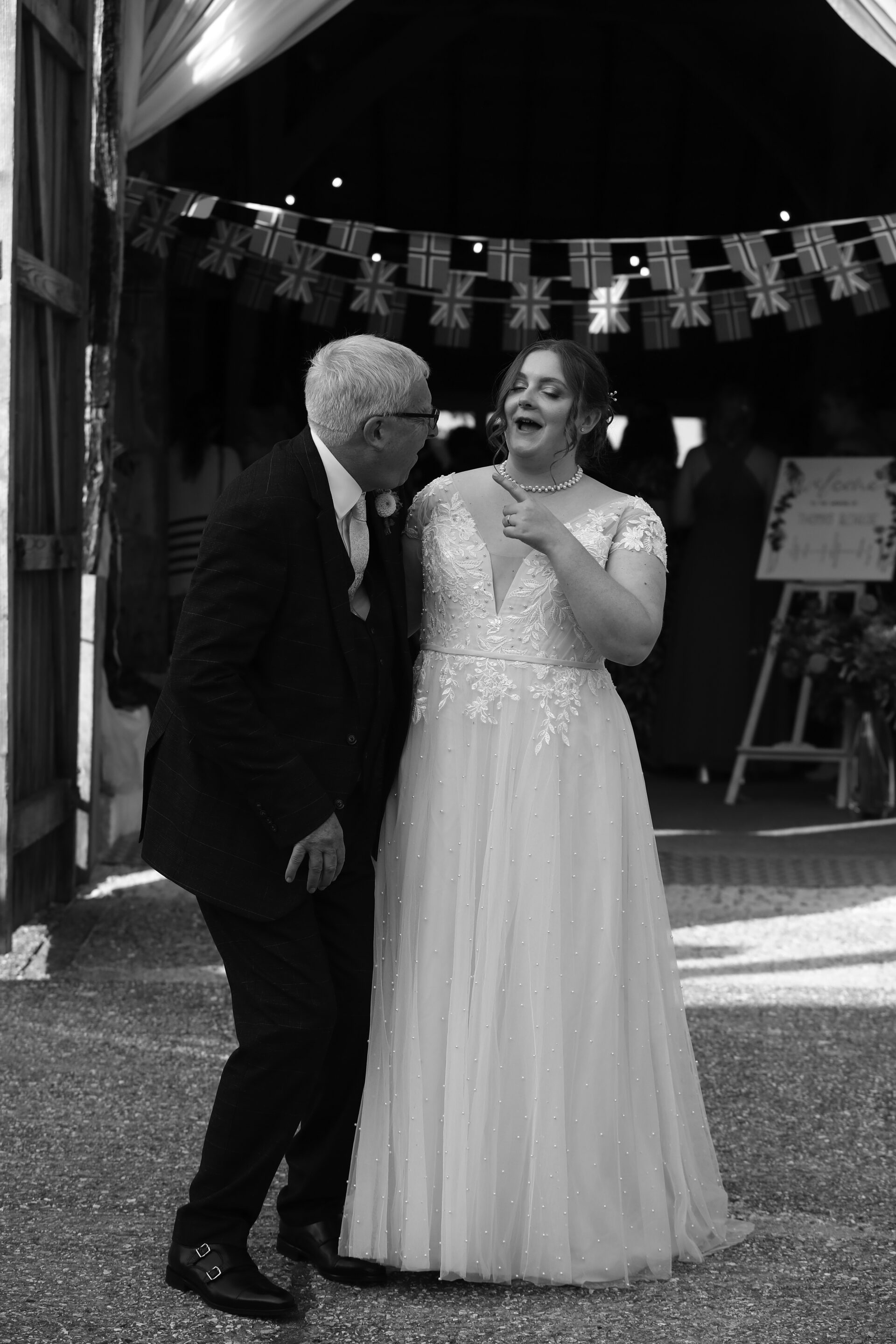 bride and bride's father at barn wedding at Sullington Manor Farm, West Sussex, RH20 4AE. Farm wedding in heart of South Downs.