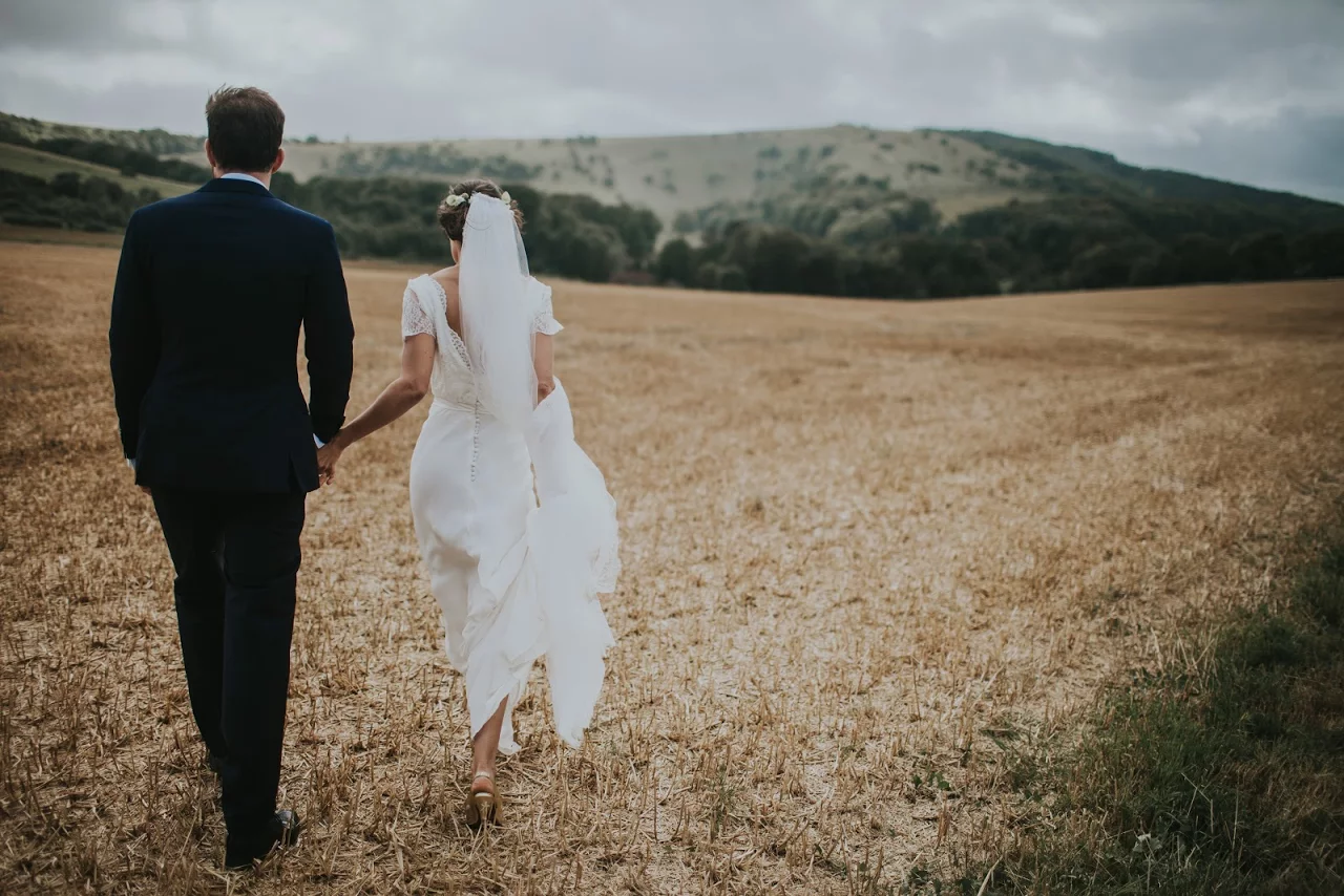 Bride and groom couple at farm wedding at Sullington Manor Farm, West Sussex, RH20 4AE. Barn wedding with accommodation in South Downs.