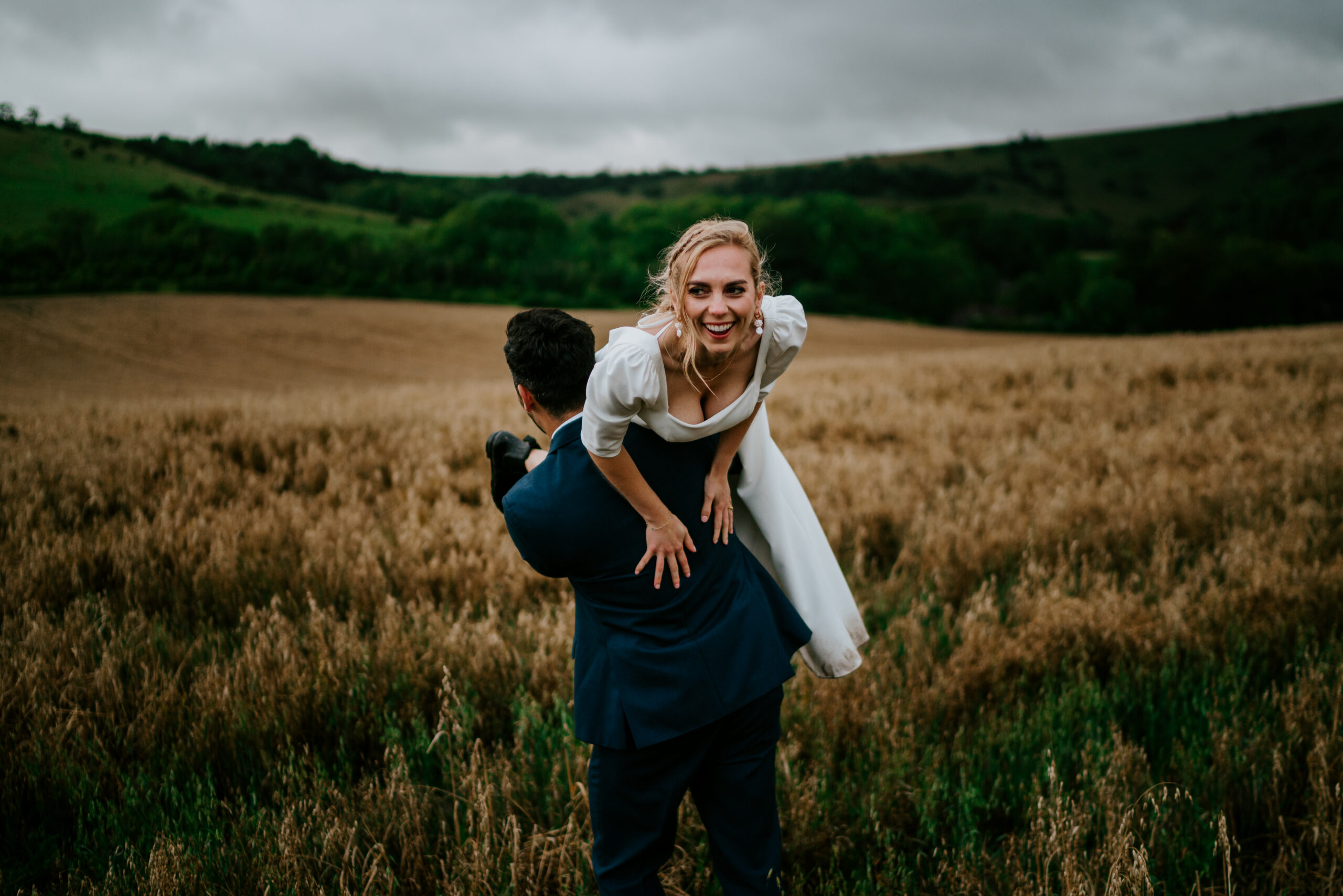 Wedding couple at Sullington Manor Farm, West Sussex, RH20 4AE. Bride and groom in South Downs. Countryside DIY barn wedding